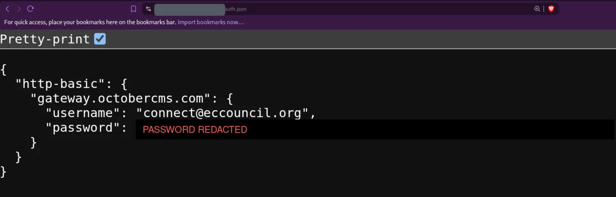 auth.json served with HTTP 200 exposing an October CMS Composer HTTP Basic credential, password redacted